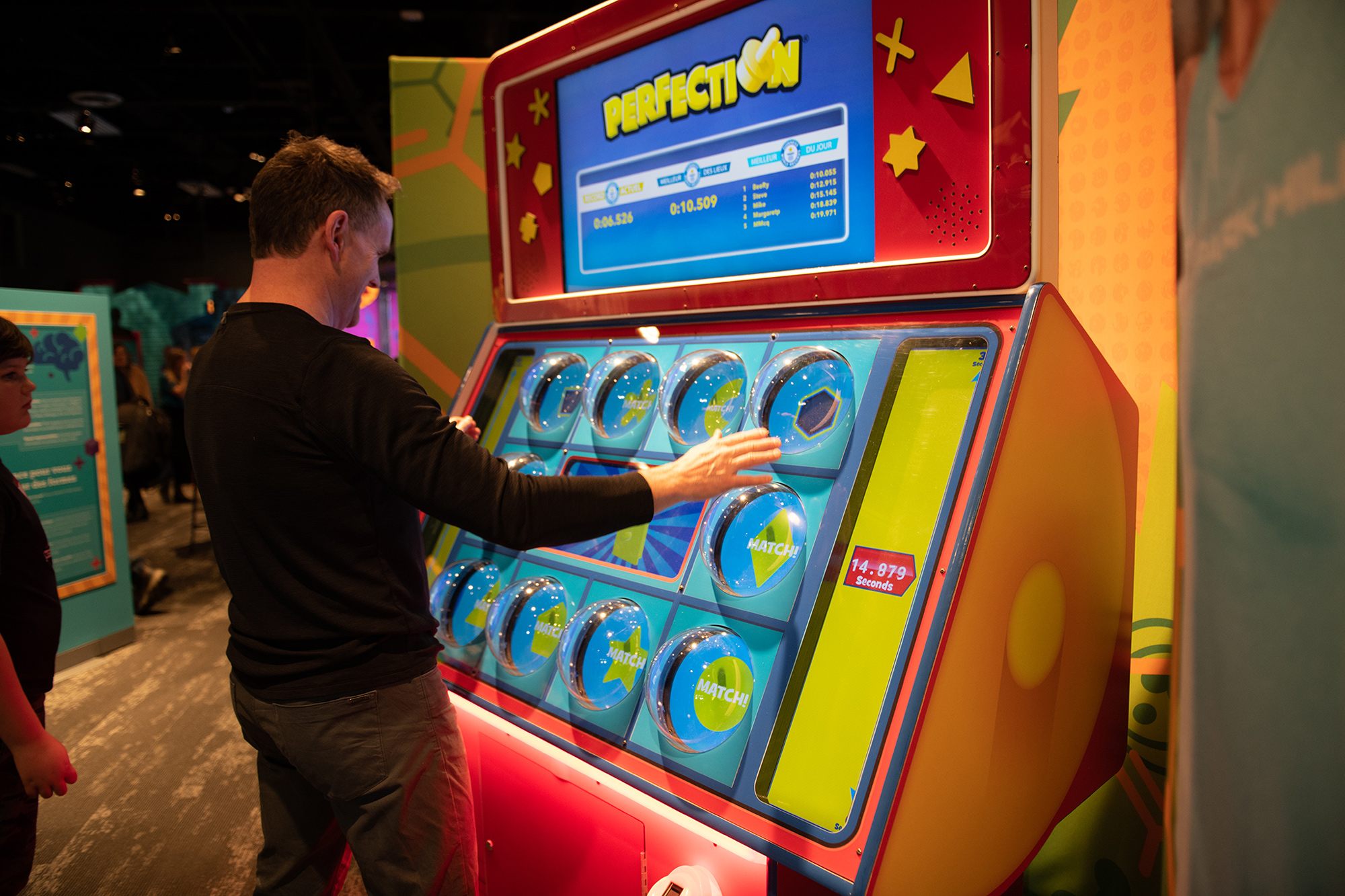 Man playing Perfection game at The Science of Guinness World Records