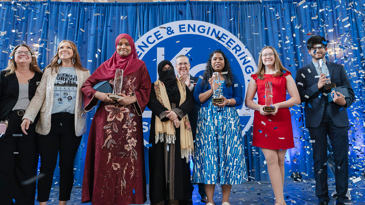 Greater Kansas City Science & Engineering Fair Winners on award stage